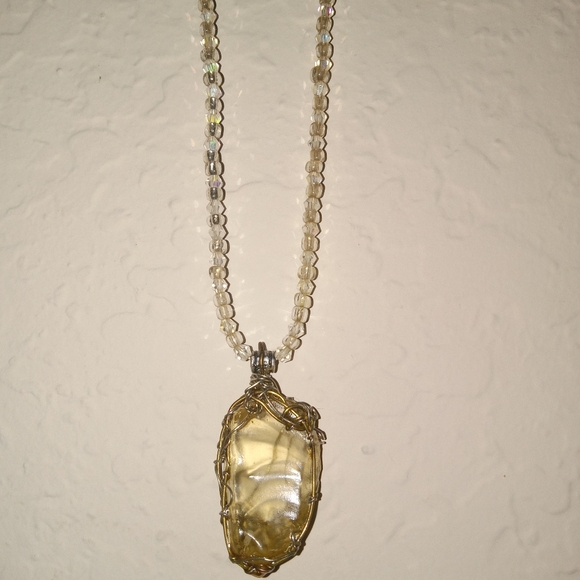 Quartz crystal emblem on a beaded necklace. - Picture 2 of 3